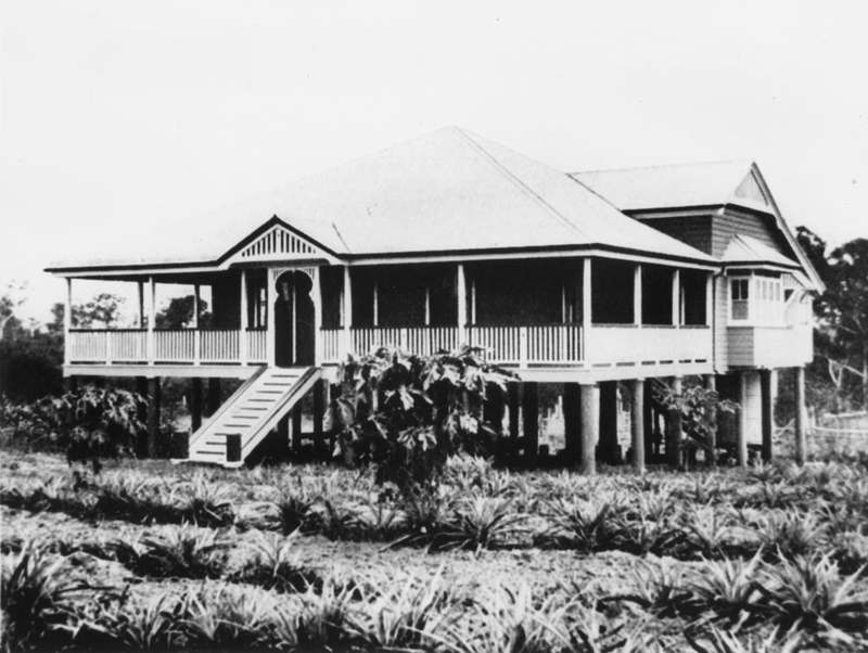 Historic photo of a raised Queenslander style timber house with a wide verandah